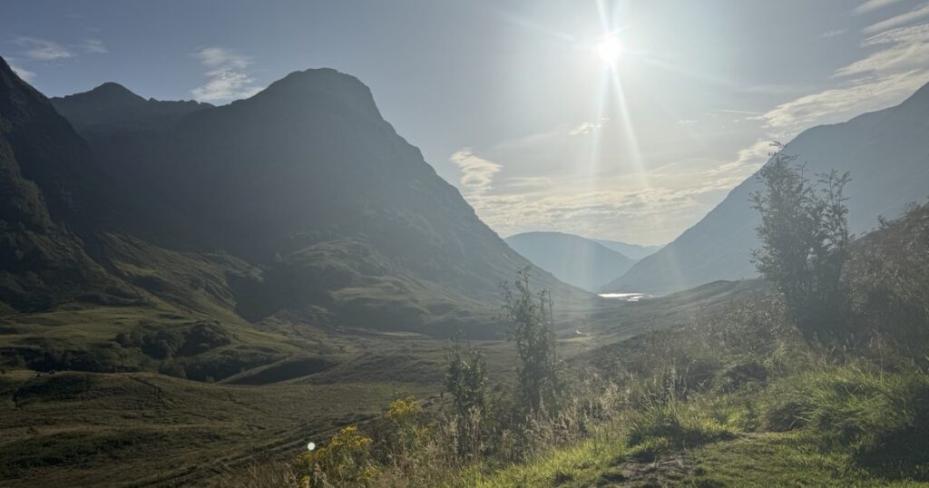 Sunlight breaking over a mountain valley